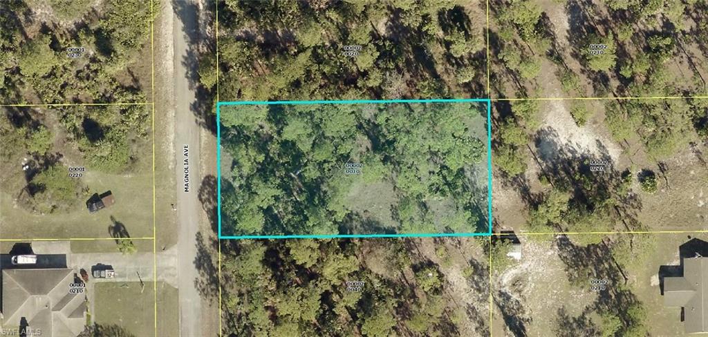 1618 Magnolia Avenue Lehigh Acres, FL 33972 - Photo 1 of 1 a view of a balcony and trees