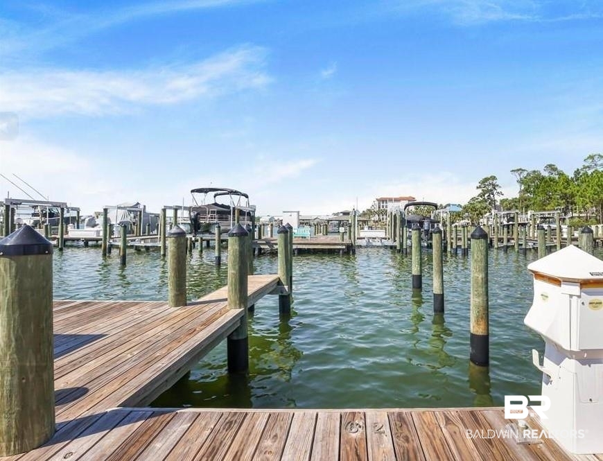 27580 Canal Road, Unit 1214 AND BOAT SLIP #62 Orange Beach, AL 36561 - Photo 63 of 67 Dock area featuring a water view and boat lift