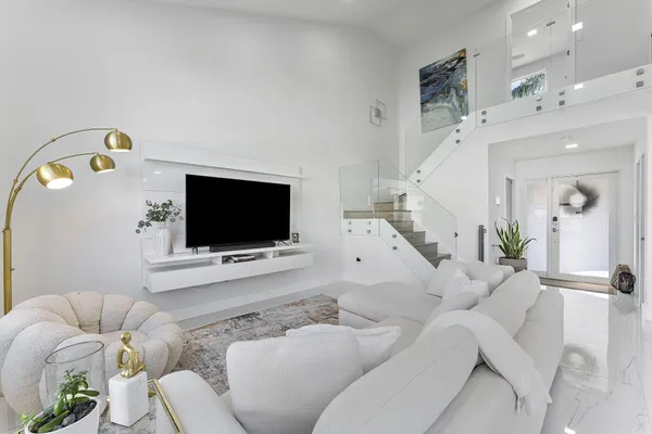 a living room with furniture and a flat screen tv