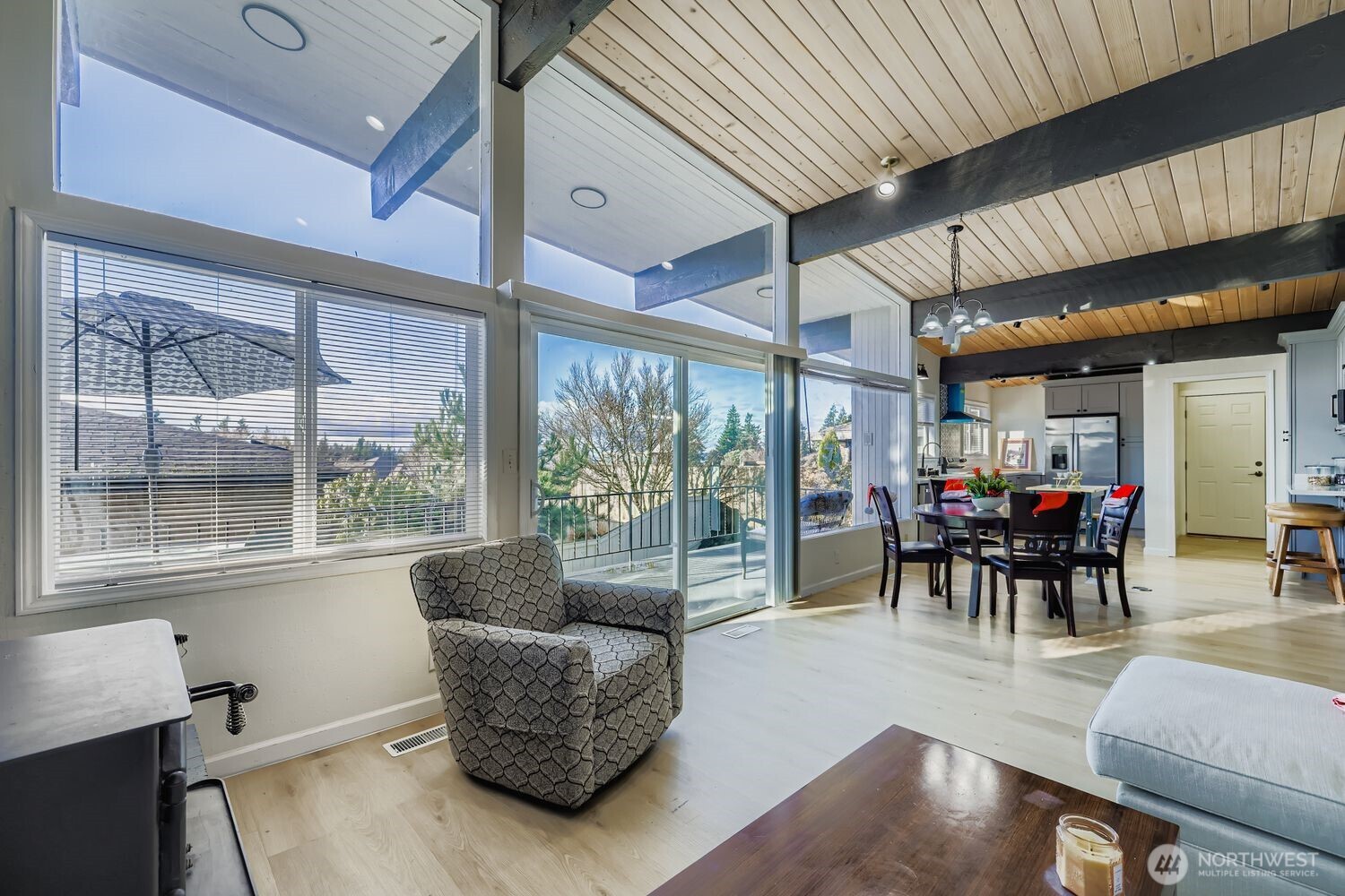 17926 73rd Avenue West Edmonds, WA 98026 - Photo 13 of 40 a dining room with furniture water view and a floor to ceiling window