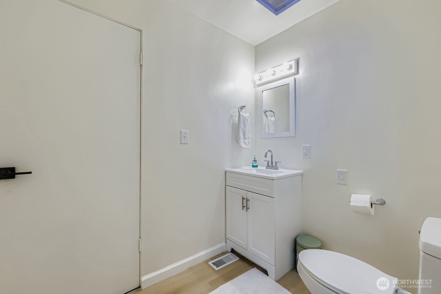 17926 73rd Avenue West Edmonds, WA 98026 - Photo 14 of 40 a bathroom with a toilet a sink a mirror and vanity