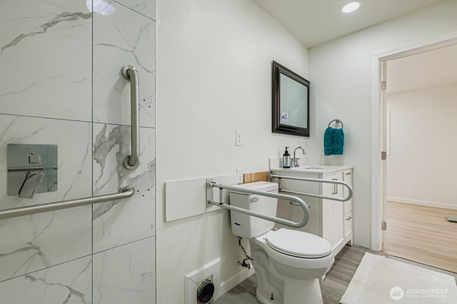 17926 73rd Avenue West Edmonds, WA 98026 - Photo 18 of 40 a bathroom with a toilet sink and mirror