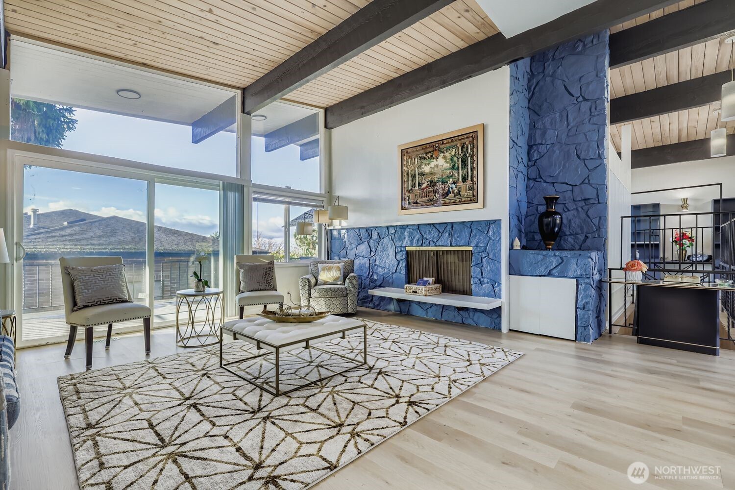 17926 73rd Avenue West Edmonds, WA 98026 - Photo 4 of 40 a living room with furniture a large window and a fireplace