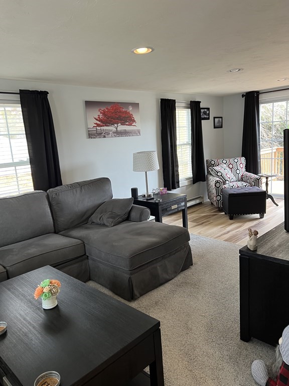 34 Colonial Road Webster, MA 01570 - Photo 12 of 35 a living room with furniture and a large window