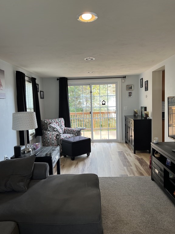 34 Colonial Road Webster, MA 01570 - Photo 13 of 35 a living room with furniture and a flat screen tv