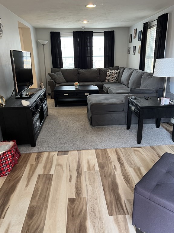 34 Colonial Road Webster, MA 01570 - Photo 15 of 35 a living room with furniture and a flat screen tv