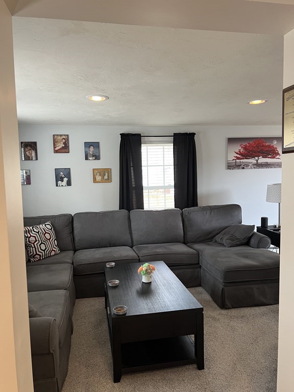 34 Colonial Road Webster, MA 01570 - Photo 16 of 35 a living room with furniture and a couch