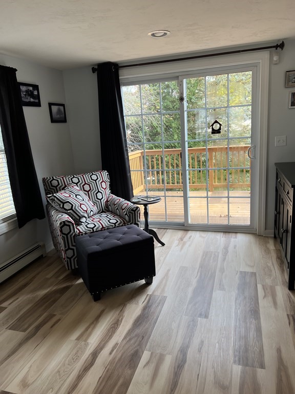 34 Colonial Road Webster, MA 01570 - Photo 18 of 35 a living room with furniture and a large window