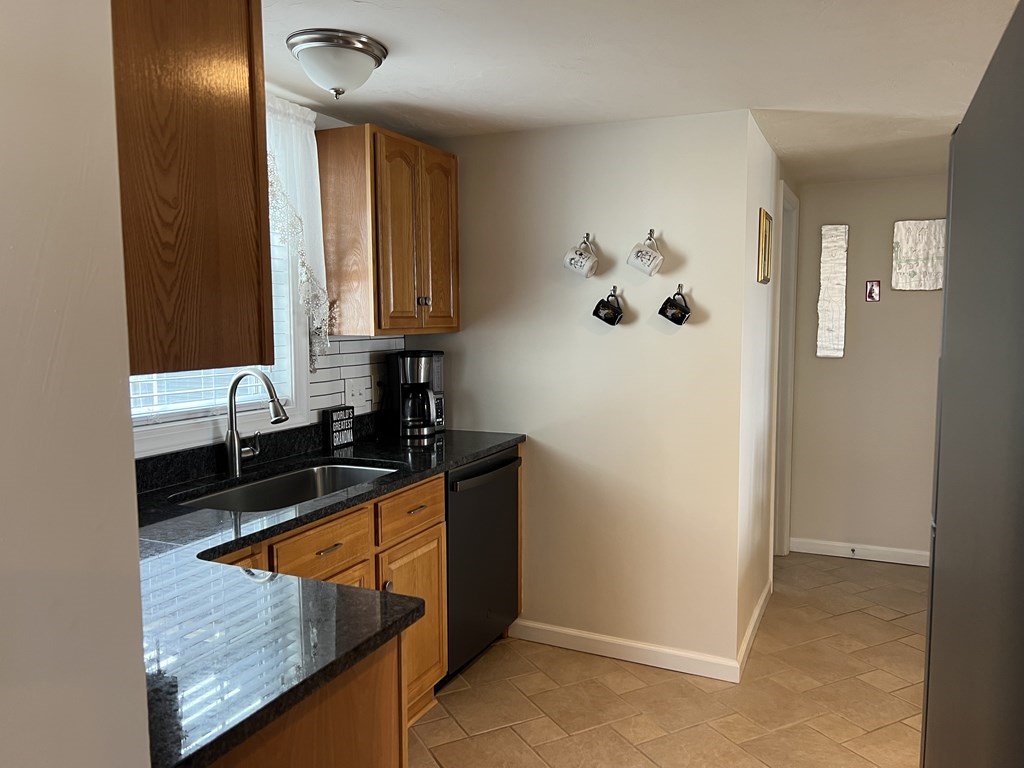 34 Colonial Road Webster, MA 01570 - Photo 19 of 35 a view of a kitchen cabinets a sink and dishwasher