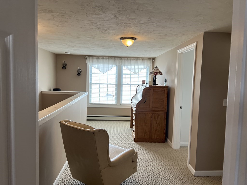 34 Colonial Road Webster, MA 01570 - Photo 24 of 35 a living room with furniture and a window