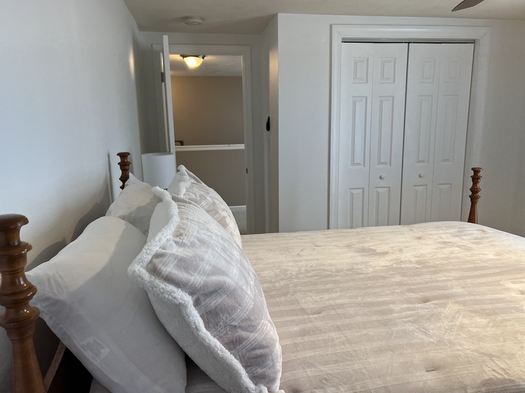 34 Colonial Road Webster, MA 01570 - Photo 26 of 35 a bed sitting in a bedroom and closet