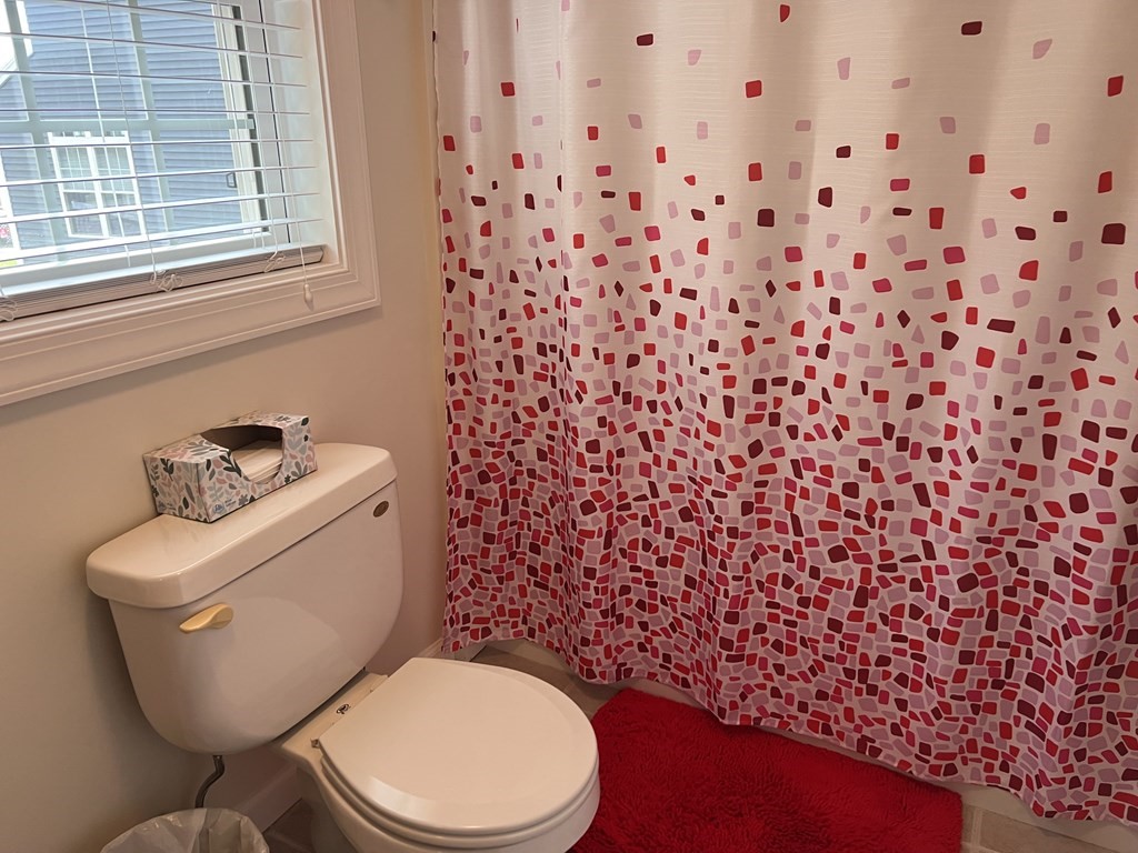 34 Colonial Road Webster, MA 01570 - Photo 28 of 35 a white toilet sitting next to a bathroom sink