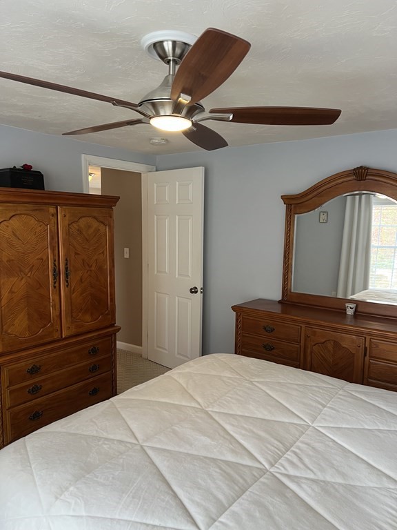 34 Colonial Road Webster, MA 01570 - Photo 34 of 35 a bedroom with a bed and a dresser