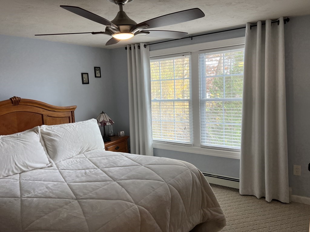 34 Colonial Road Webster, MA 01570 - Photo 35 of 35 a bedroom with a large bed and a window