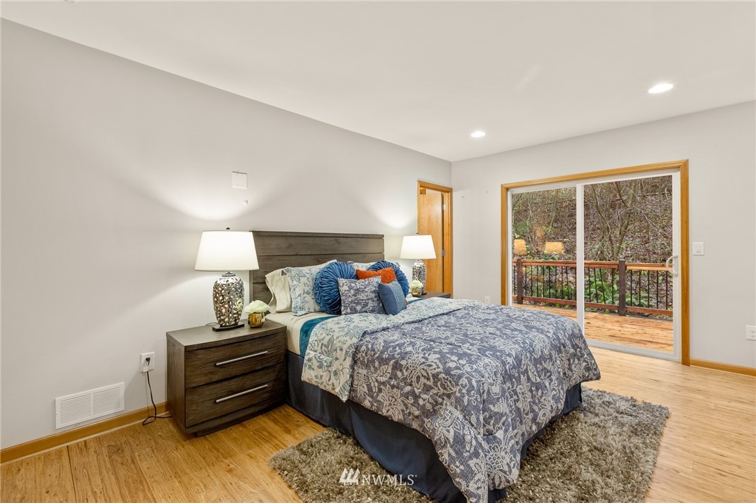 18645 Renton-Maple Valley Road Maple Valley, WA 98038 - Photo 12 of 30 a bedroom with a bed and wooden floor