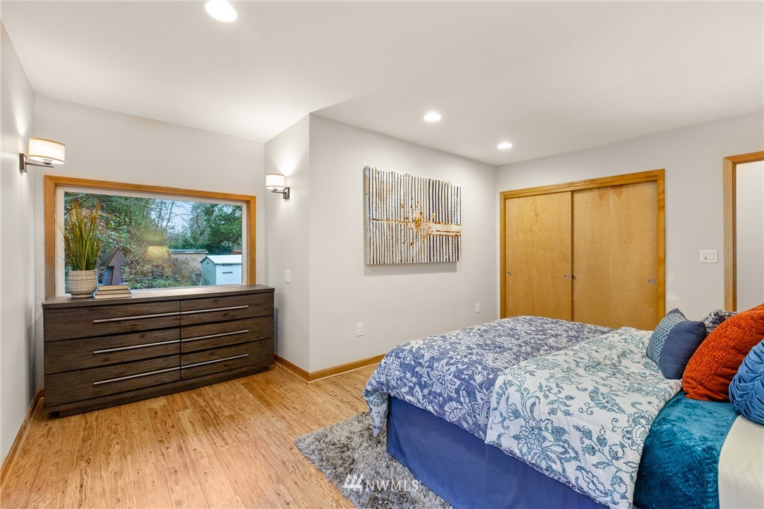 18645 Renton-Maple Valley Road Maple Valley, WA 98038 - Photo 14 of 30 a bedroom with a large bed and a window