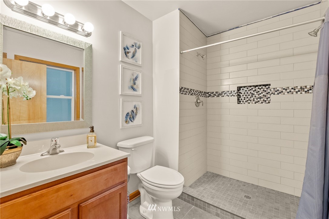 18645 Renton-Maple Valley Road Maple Valley, WA 98038 - Photo 15 of 30 a bathroom with a sink toilet and shower