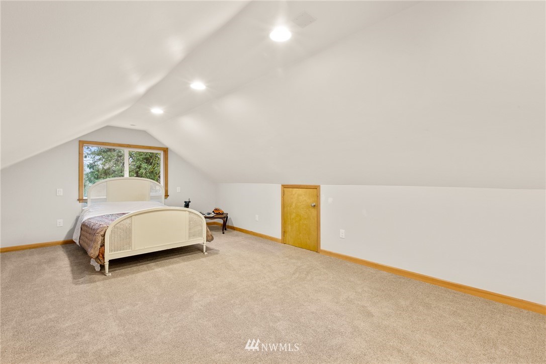 18645 Renton-Maple Valley Road Maple Valley, WA 98038 - Photo 21 of 30 a bedroom with a bed and a night stand