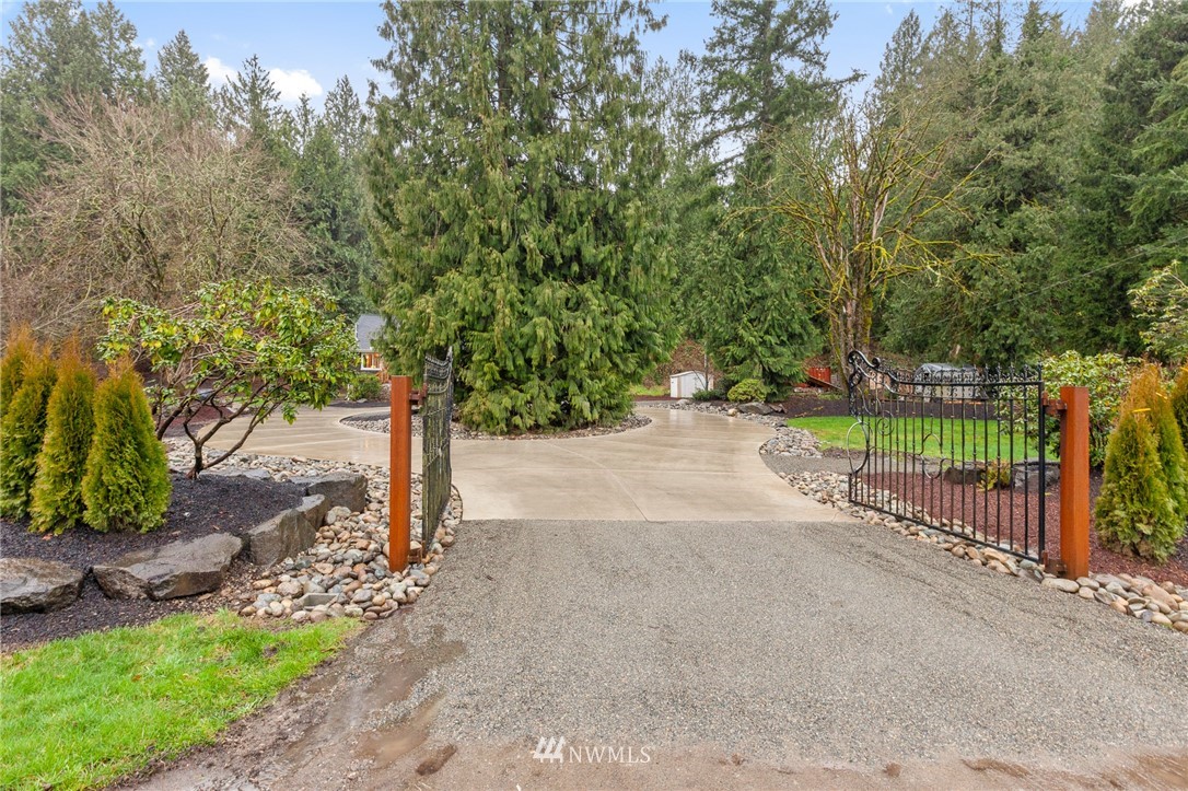 18645 Renton-Maple Valley Road Maple Valley, WA 98038 - Photo 26 of 30 a street view with large trees
