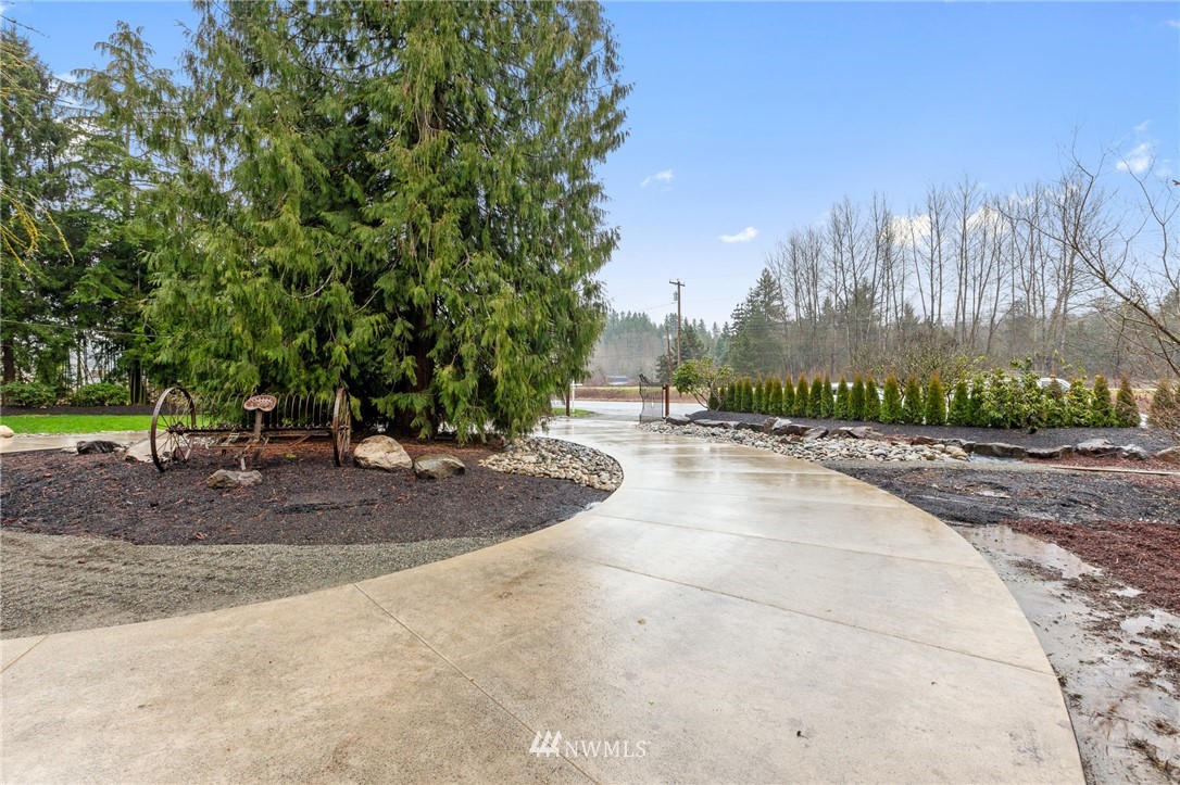 18645 Renton-Maple Valley Road Maple Valley, WA 98038 - Photo 27 of 30 a view of a yard with plants and trees