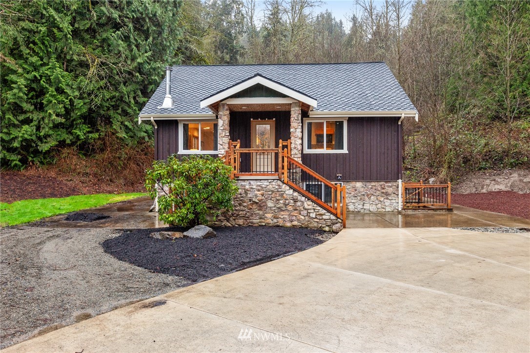 18645 Renton-Maple Valley Road Maple Valley, WA 98038 - Photo 29 of 30 a front view of a house with a yard and garage