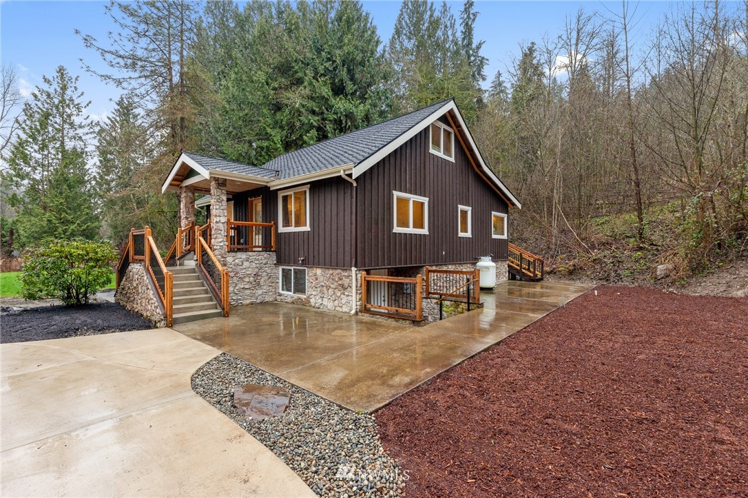 18645 Renton-Maple Valley Road Maple Valley, WA 98038 - Photo 30 of 30 a view of a house with backyard and sitting area