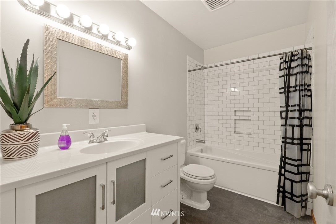 18645 Renton-Maple Valley Road Maple Valley, WA 98038 - Photo 10 of 30 a bathroom with a sink a toilet and shower