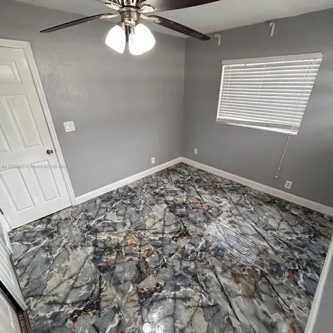 a view of a window in an empty room