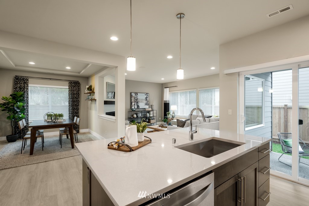 3602 200th Place Southeast, Unit KF15 Bothell, WA 98012 - Photo 13 of 34 a kitchen with a sink a counter and chairs