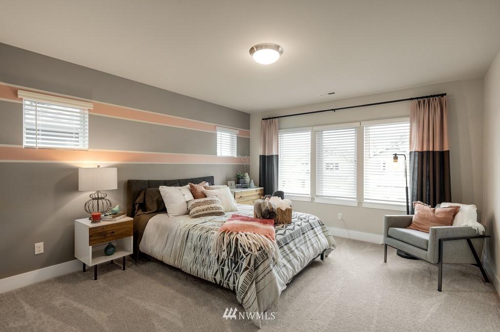 3602 200th Place Southeast, Unit KF15 Bothell, WA 98012 - Photo 20 of 34 a bedroom with a bed and a couch