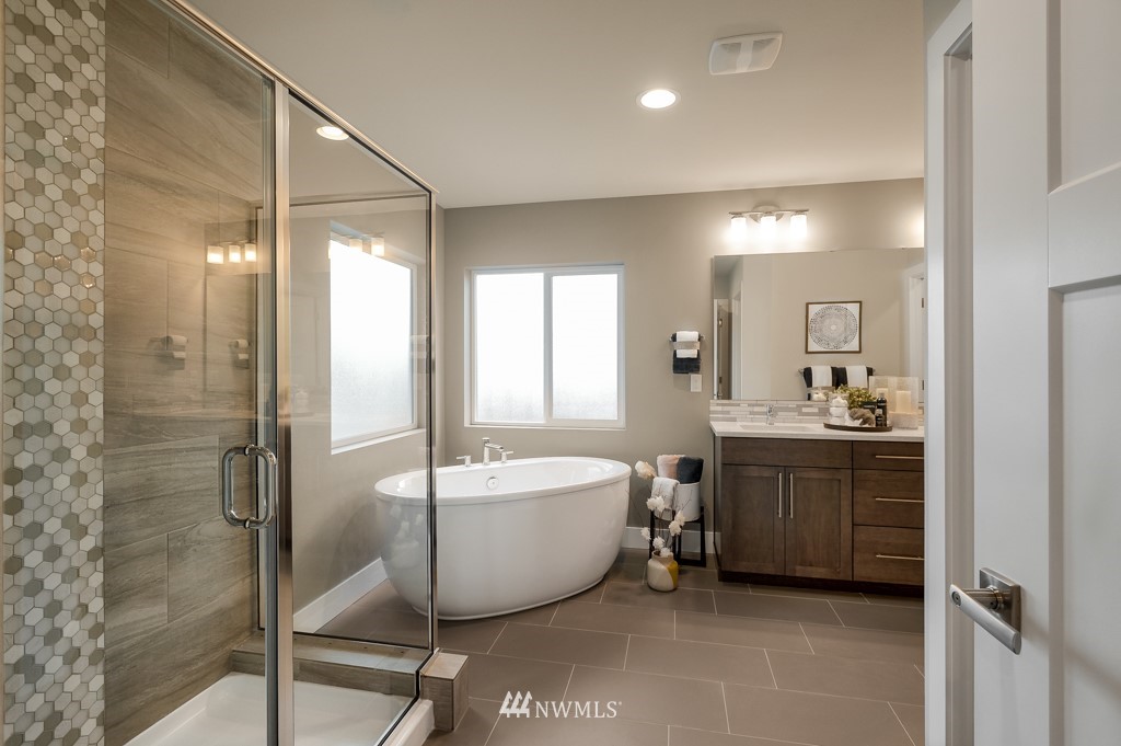 3602 200th Place Southeast, Unit KF15 Bothell, WA 98012 - Photo 27 of 34 a spacious bathroom with a bathtub shower sink and mirror
