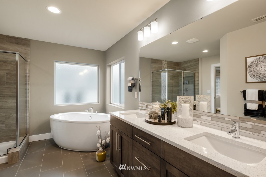 3602 200th Place Southeast, Unit KF15 Bothell, WA 98012 - Photo 30 of 34 a bathroom with a bathtub sink and mirror