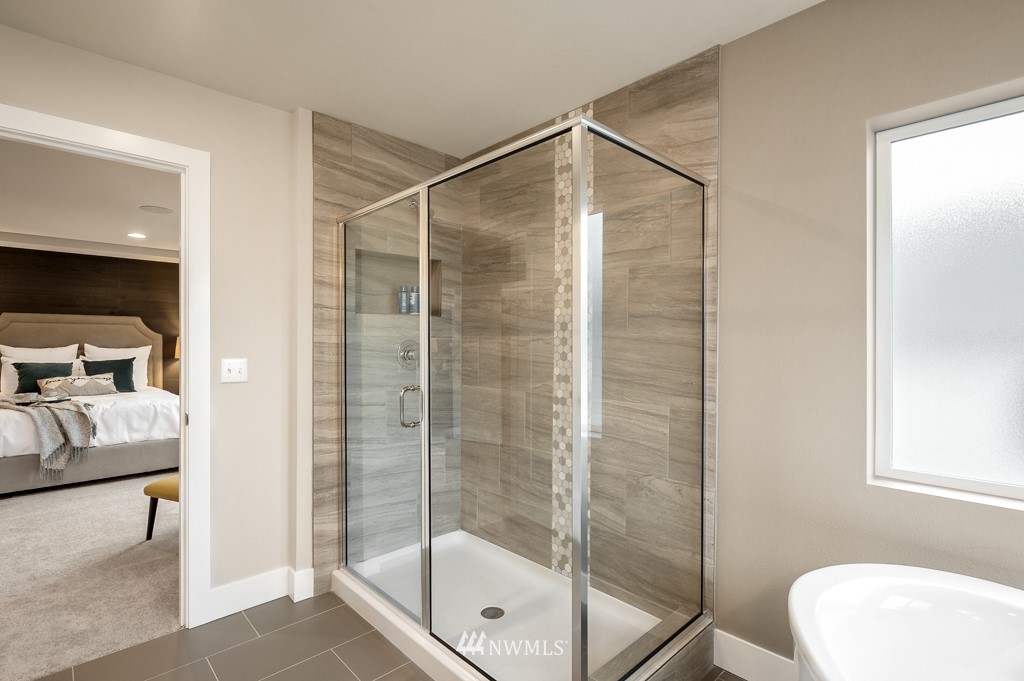 3602 200th Place Southeast, Unit KF15 Bothell, WA 98012 - Photo 31 of 34 a bathroom with a shower a toilet and a sink
