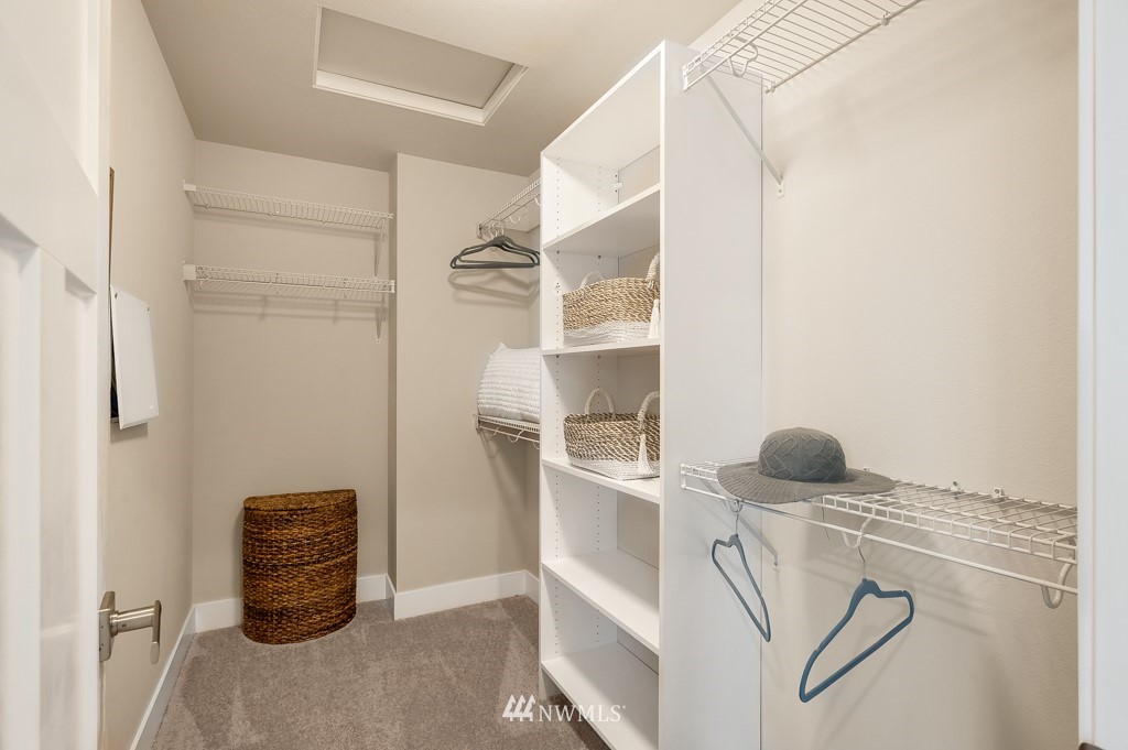 3602 200th Place Southeast, Unit KF15 Bothell, WA 98012 - Photo 32 of 34 a view of walk in closet with clothes and shoes