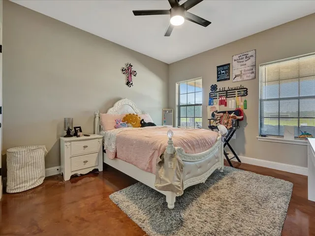 a bed room with a bed and a chandelier