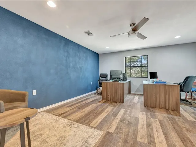 a bed room with a bed and a television