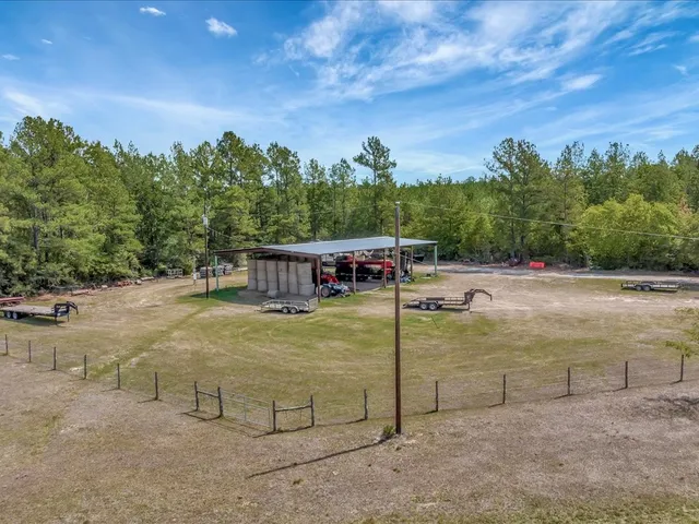 a view of a swimming pool with an outdoor seating