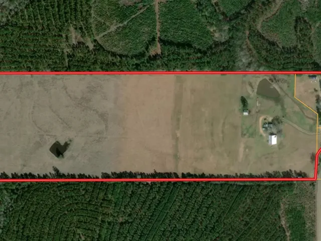 a view of swimming pool and red chair
