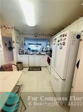 a room with lots of appliances and cabinets