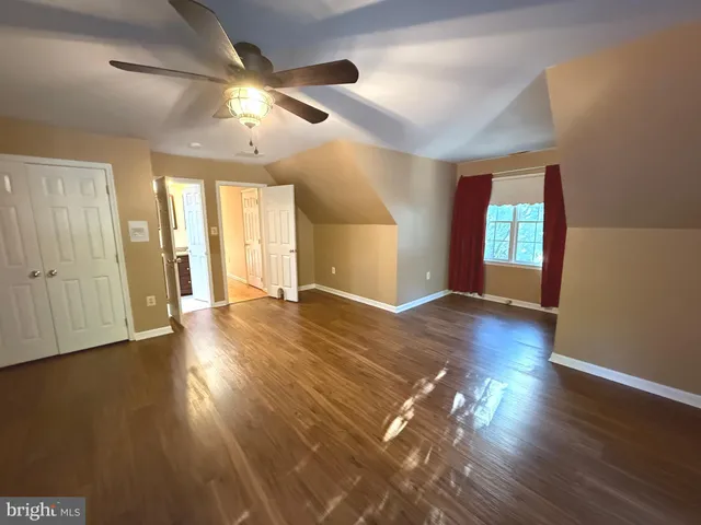 a bathroom with a shower and a toilet