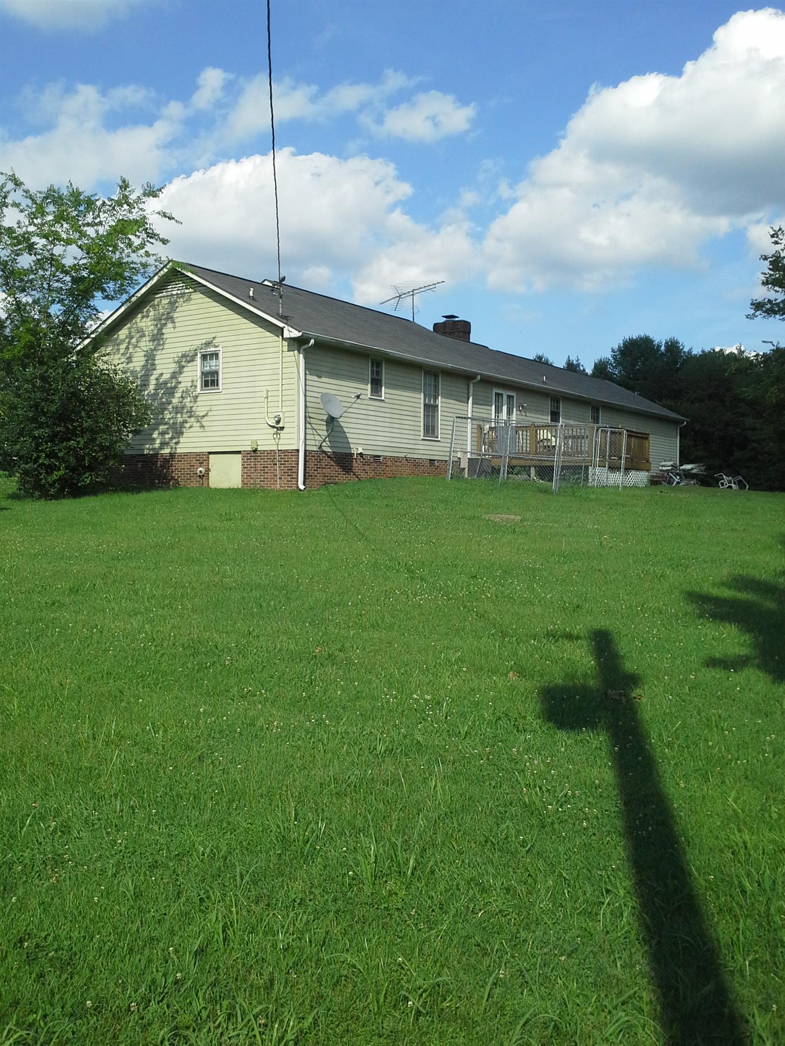 7271 Hoods Branch Road Springfield, TN 37172 - Photo 4 of 11 a view of a backyard with plants and a garden
