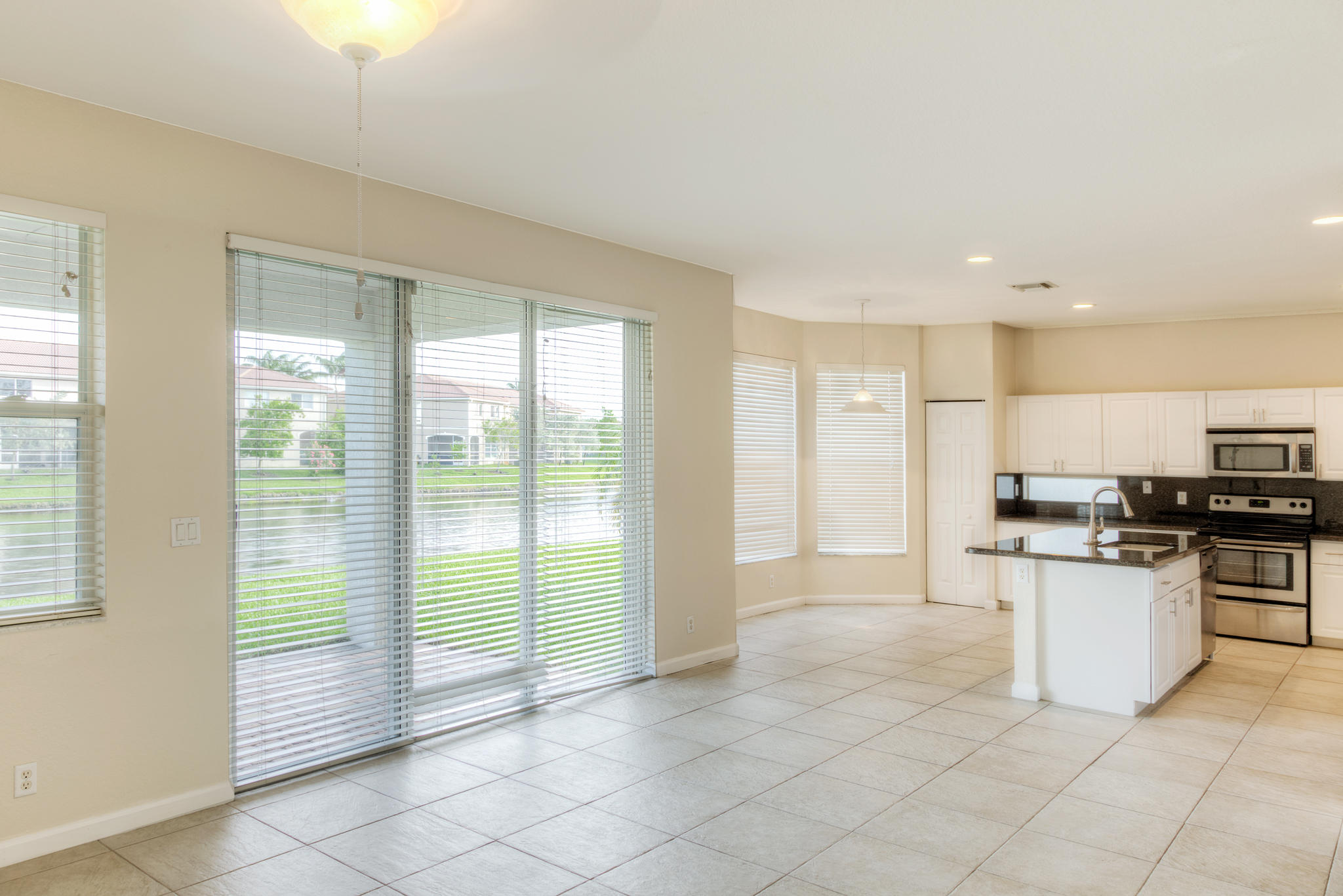 1100 Center Stone Lane Riviera Beach, FL 33404 - Photo 9 of 28 Family Room to Kitchen