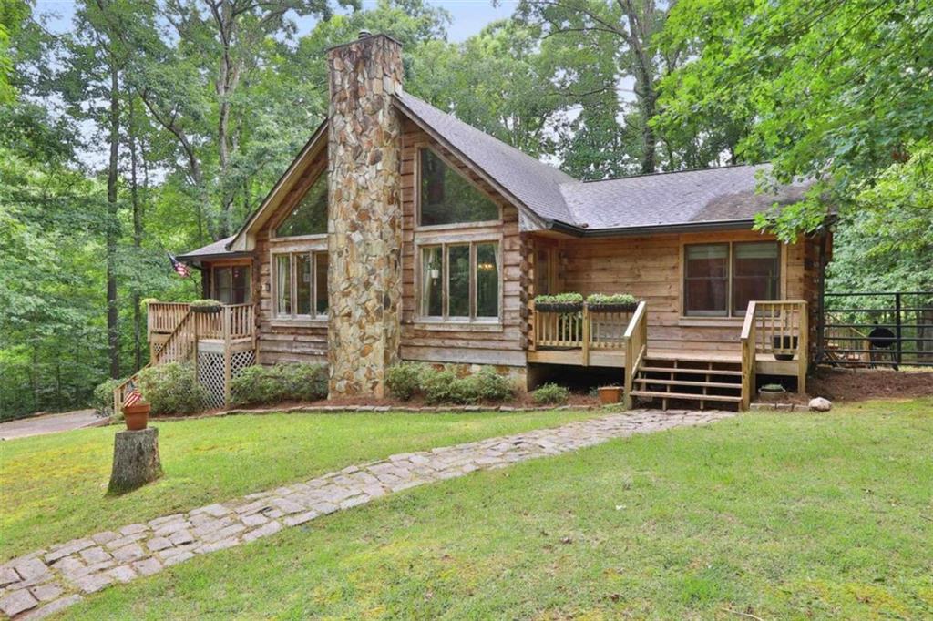 3364 East Baggett Road Winston, GA 30187 - Photo 1 of 1 a front view of house with yard and green space