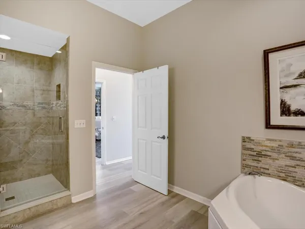 a bathroom with a bathtub and shower