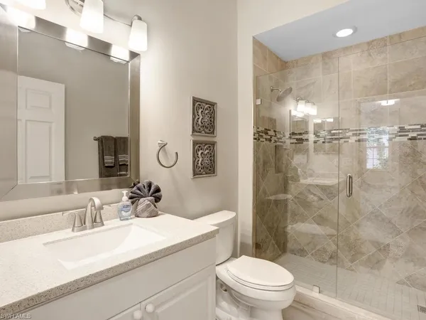 a bedroom with a bed and a table