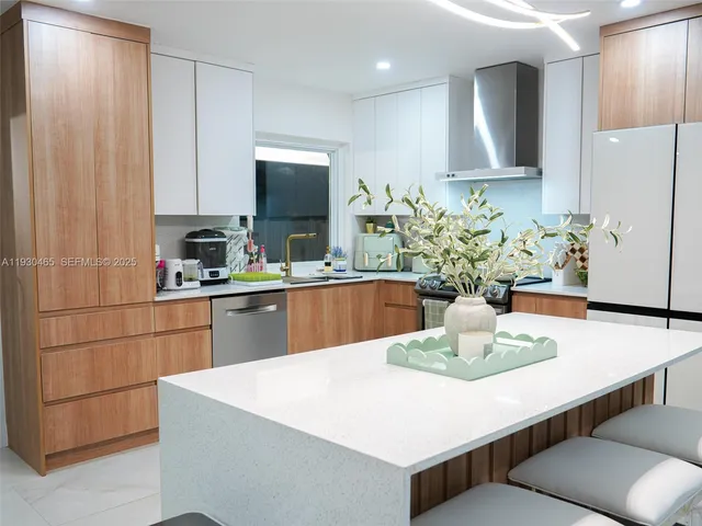 a kitchen with a table and chairs