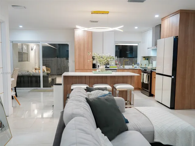 a living room with furniture and a rug