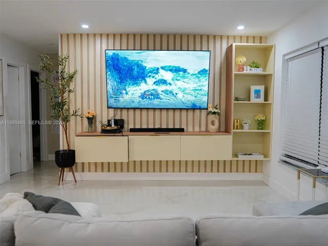 a view of a swimming pool with a patio and a yard