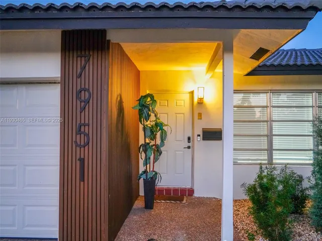 a bedroom with a bed and a mirror