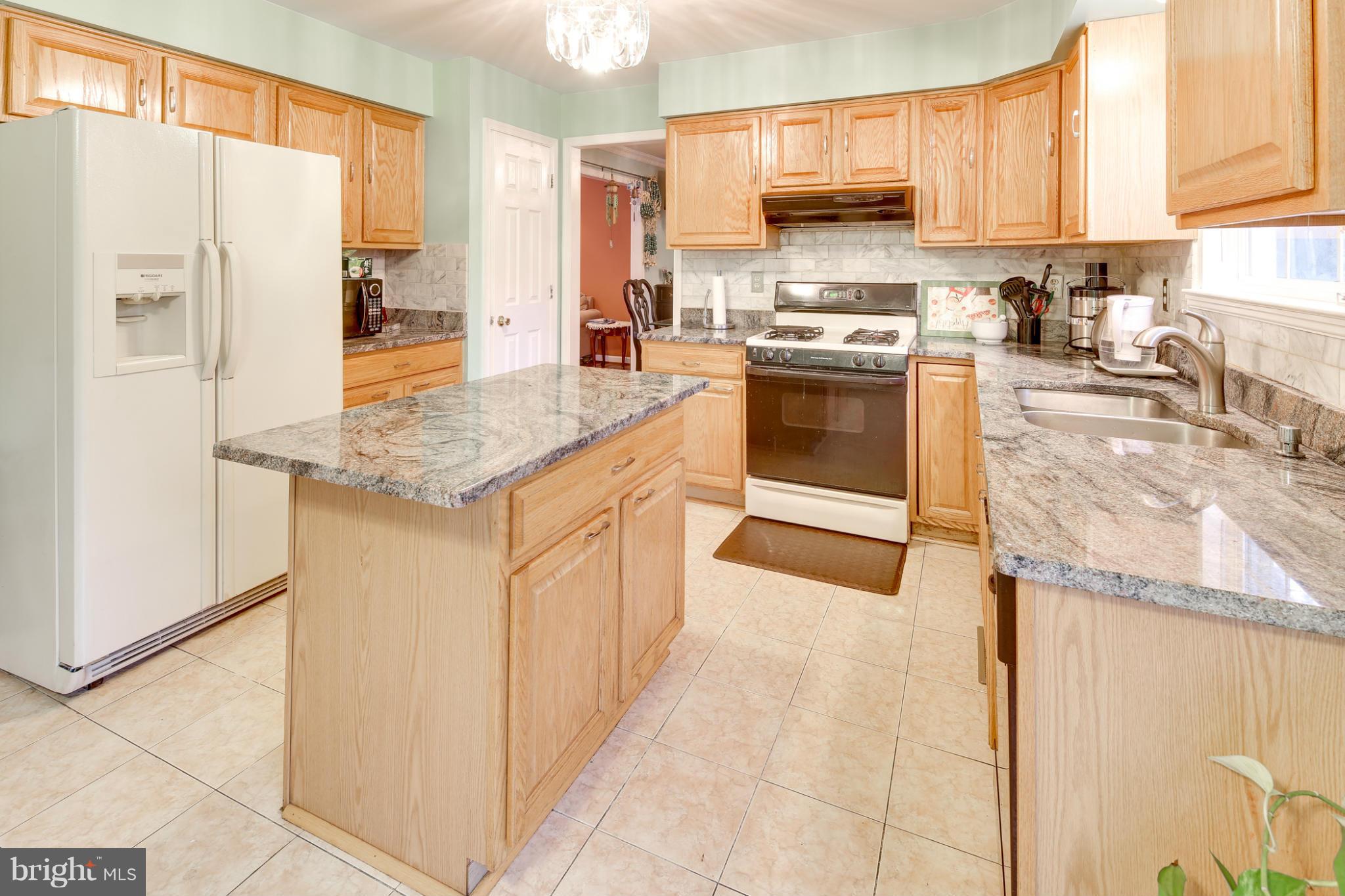 6375 Waterloo Road Elkridge, MD 21075 - Photo 2 of 30 a kitchen with stainless steel appliances granite countertop a stove a refrigerator and a oven